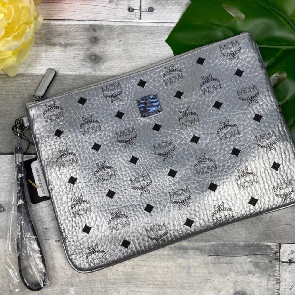 MCM medium silver metallic pouch is wristlet